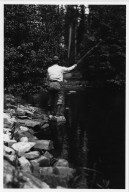 Unidentified man fishing in mountain stream