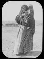 Native American woman holding child