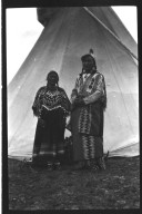 Man and woman outside tipi