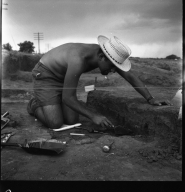 Excavation site worker with tools