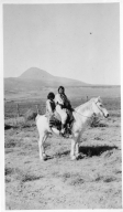 Portrait of Ute Mountain Ute woman and boy on a horse