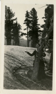 Margaret behind tree