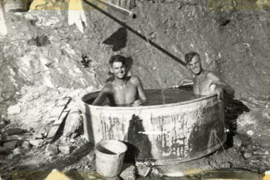 Crew bathing in washtub