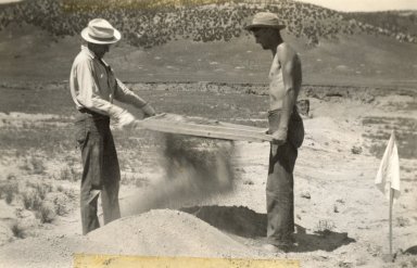 Sifting dirt at site