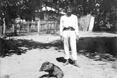Young man and peccary