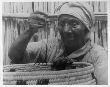 Chona Weaving a Basket