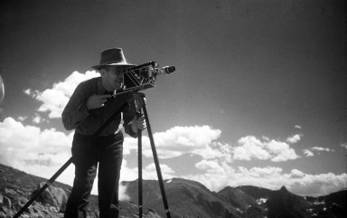 Alfred M. Bailey with motion picture camera