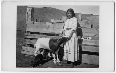 Apache girl training a shepherd dog