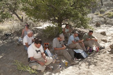 The Excavation Team takes a lunch break in the limited shade on the Kaiparowits Plateau.