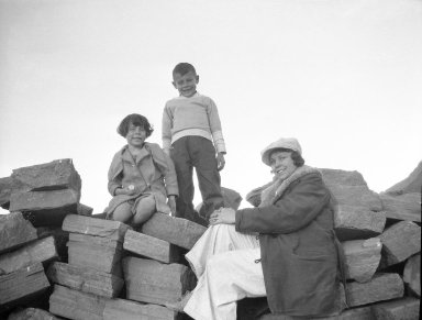 Unidentified woman and children