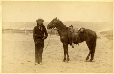 American Indian Man  with Saddled Horse