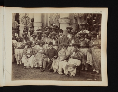 Group portrait of 21 Ceylonese men and two European men.