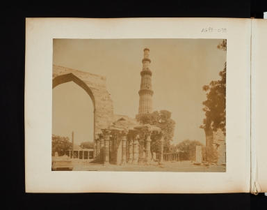 Ruins of a large complex in Delhi, India. In the background is the Khutah Minar Tower.