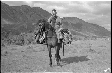 Dick Morris on horseback near Lewis Pass