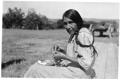 Sioux woman doing beadwork
