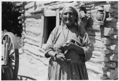 Old Sioux woman with puppy