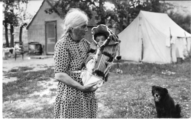 Old Sioux woman with baby in cradleboard