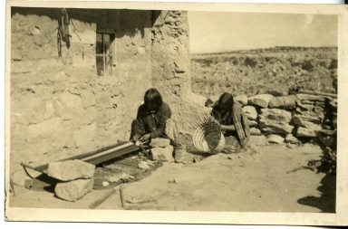 Man weaving and woman making a basket, Hopi Reservation